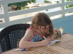 Writing in her journal on our balcony at Beaches Boscobel