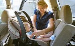 Baby in back seat car seat