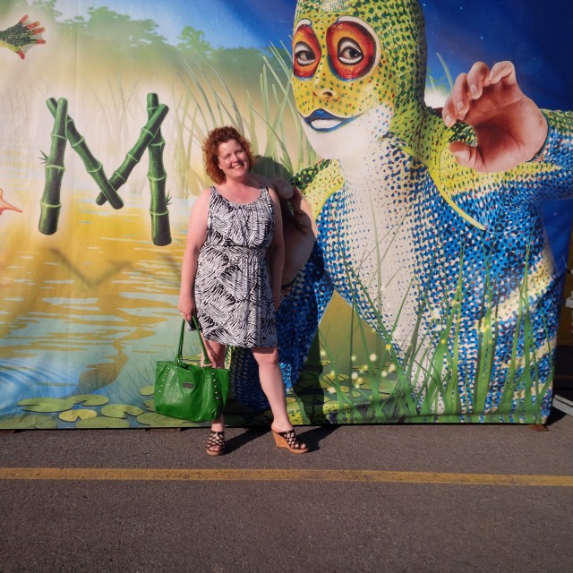 coffee with julie in front of totem banner